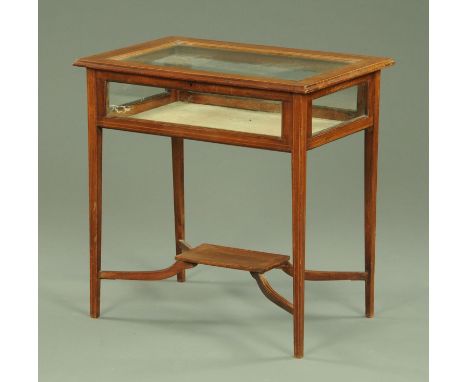 An Edwardian boxwood strung bijouterie table, raised on tapered legs of square section with low small shelf and stretchers.  