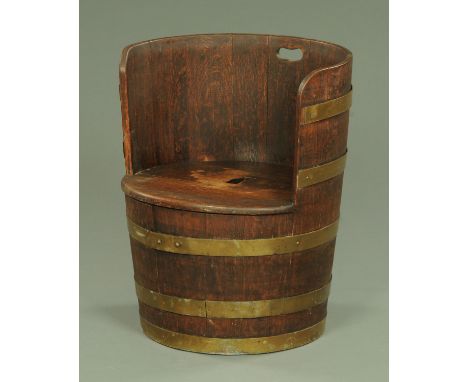 A 19th century barrel form stool, brass bound.  Width 53 cm, height to top of back 65 cm. 