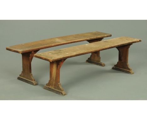 A pair of late Victorian oak benches, each with silhouette supports, length 167 cm. CONDITION REPORT: Both benches are struct