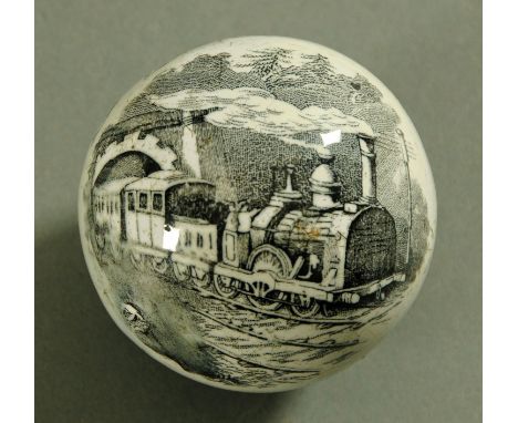 A rare Whitehaven pottery carpet bowl, early to mid 19th century, with black printed decoration of a steam train passing thro