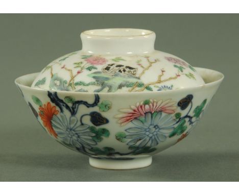 A Chinese Wucai bowl, 18th/19th century, decorated throughout with carnations and peony, the carnation petals being transluce