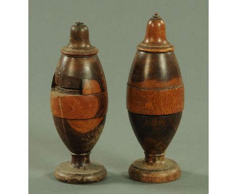 A pair of 18th century Lignum Vitae coffee grinders, with bell shaped tops and on circular feet.  Heights 26 cm and 25 cm (se