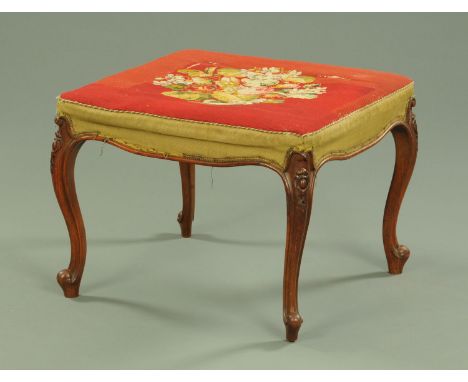 A Victorian walnut square stool, with floral tapestry top, supported upon slender cabriole legs with carved knees, with appli