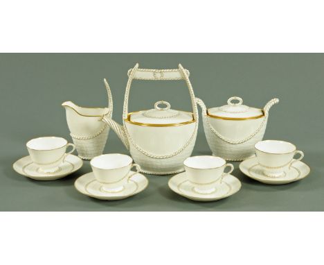  A French porcelain four place tea set, early 20th century, each piece with moulded woven decoration and rope twist borders, 