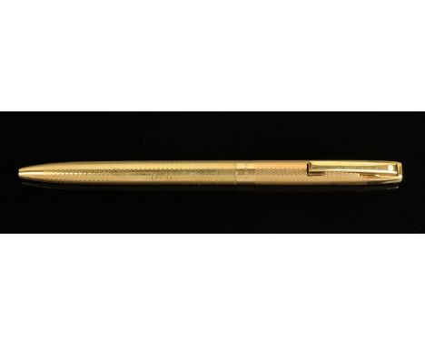 A Sheaffer 9 ct gold ballpoint pen, with engine turned decoration (see illustration).