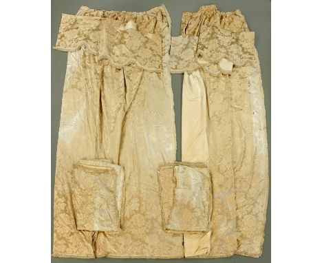 Two pairs of silk curtains, beige with embossed foliate pattern, drop +/- 320 cm, each curtain width +/- 190 cm, with one pel