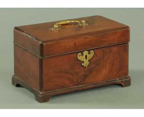 A George III mahogany casket, with brass carrying handle and lock escutcheon, three interior divisions and raised on bracket 