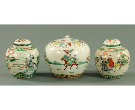 A pair of Chinese Famille Verte ginger jars and covers, late 19th/early 20th century, each depicting warriors and a scholar o