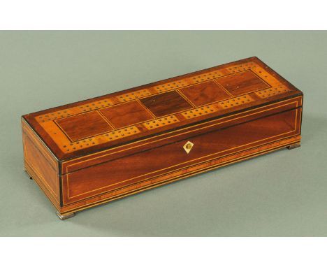 A mahogany and variegated wood inlaid cribbage board, 19th century, the lid opening to reveal later playing cards, the lock f