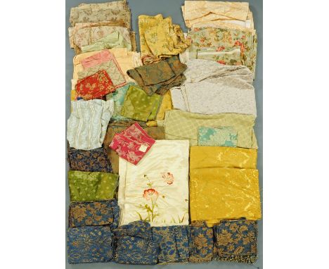 A large quantity of pieces of vintage fabric, various patterns and sizes.