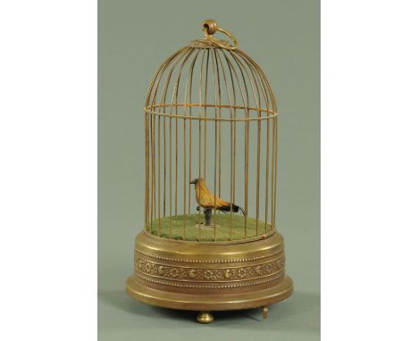 A bird cage automaton, late 19th/early 20th century, the cage with a single suspension hoop housing a bird on a perch.  Heigh