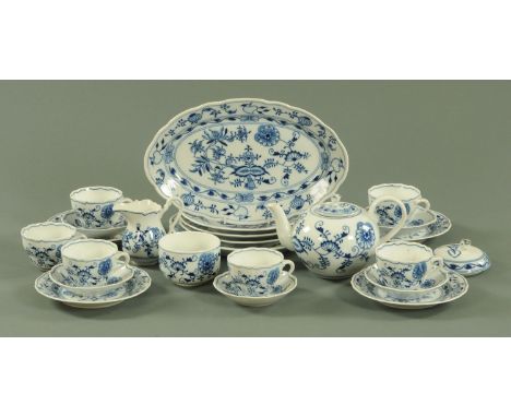 A Continental porcelain Onion pattern part dinner and tea service, comprising a large dished plate, 3 dinner plates, 4 side p