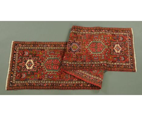 An Iranian fringed runner, woollen, principal colours red, beige and green.  310 cm x 75 cm (see illustration).