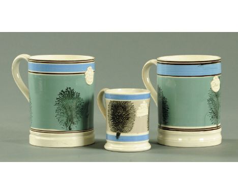 A pair of Mocha imperial quart tankards, 19th century, and an imperial half pint Mocha tankard.  Height 15 cm and 10 cm (see 