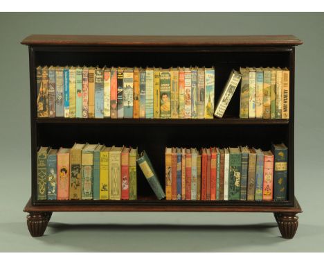 A 19th century mahogany open bookcase, with moulded edge above a single adjustable shelf with moulding below and raised on tu