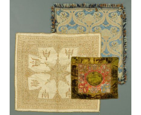 An Indian hand embroidered bedspread, with central star motif and flowers and floral running borders embroidered with gold co