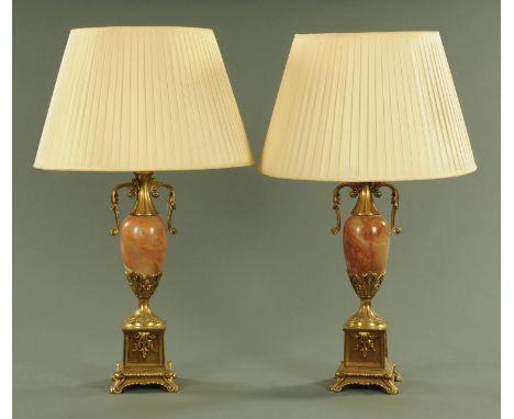 A pair of rouge marble and gilt metal mounted table lamps, 20th century, having a vase shaped polished stone body with gilt m