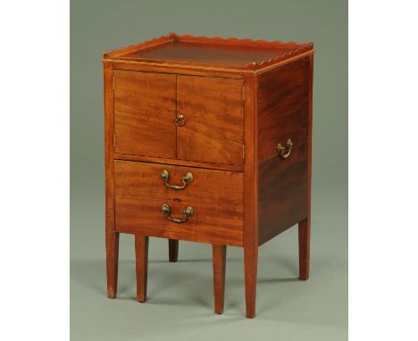 A George III mahogany commode, with wavy gallery above a pair of doors and commode drawer and all raised on tapered legs of s