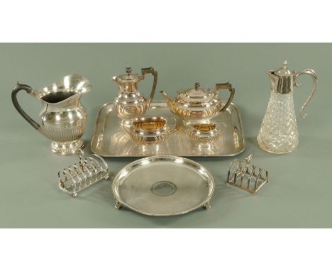 A four piece silver plated tea service, lemonade jug, rectangular tray, two toast racks, circular tray and claret jug. 