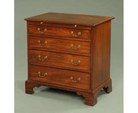 A George III mahogany chest of drawers, with moulded edge and brushing slide above four long graduated drawers with brass swa