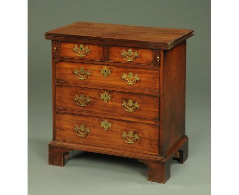 A George III mahogany bachelor's chest, with turnover top above two short and three long graduated drawers with brass drop ha