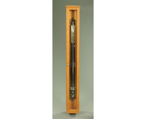 A mercury stick barometer with thermometer, with adjustable Vernier from 865-1100 and in teak cabinet, overall height 141 cm.