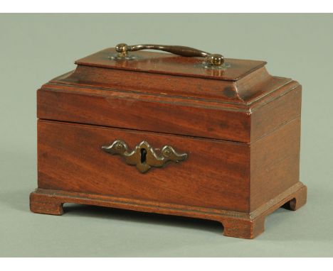 A small Georgian style mahogany tea caddy, with painted brass carrying handle and escutcheon, the interior with three divisio
