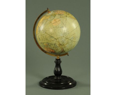 A Philip's 9" terrestrial globe, on turned ebonised stand.  Overall height 42 cm.   CONDITION REPORT: The globe itself is str