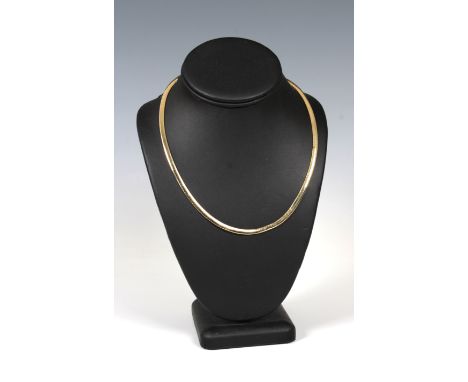 A 14k gold flexible choker, 46cm. when open.