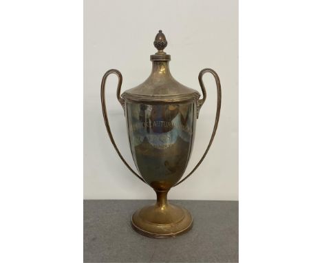 Horse Racing interest - A silver lidded and footed two handled trophy cup, Barker Brothers, Chester, 1922, with acorn finial,
