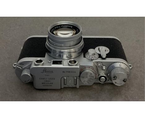 A Leica IIIf chrome rangefinder camera, serial number 798034 with Leitz Summicron f=5cm 1:2 lens 1204327, with accessories.