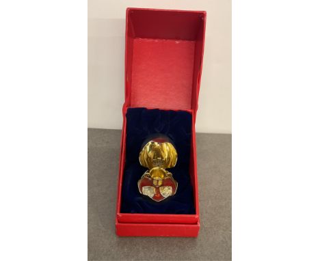 A Bruce Russell silver 1982 Royal Surprise Egg commemorating the birth of Prince William, opening to reveal miniature christe