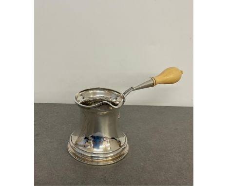 A French silver brandy warmer with turned ivory handle, rubbed mark to the side and base "....Fils", engraved cartouche, 9cm.