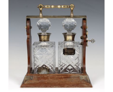 A double tantalus with silver mounted decanters, S J Rose &amp; Son, Birmingham, 1983, together with silver labels.