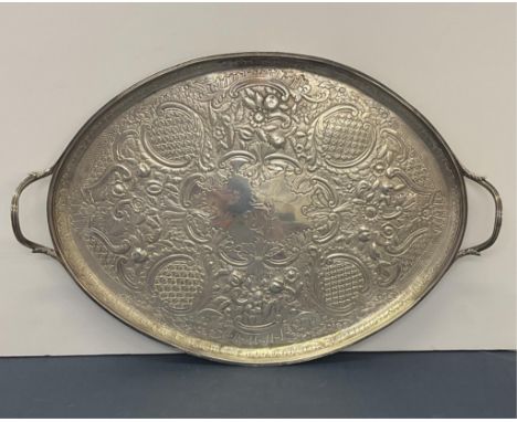 A George III silver large oval twin handled tray, Elizabeth Jones, London, 1793, having reeded borders and handles, the centr