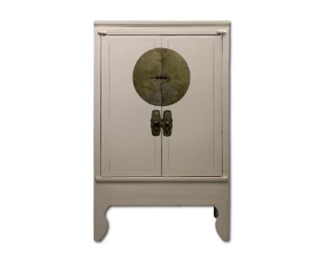 A Chinese wedding cabinet, 20th Century, painted in a soft grey, the cupboard doors with central metal lock plate opening to 
