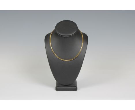 An 18ct yellow gold choker.,