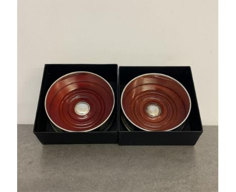 A pair of silver and turned wood wine coasters, London, maker's mark SH, 10.3cm. diameter, both boxed.