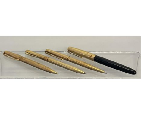 Parker: A set of three 9ct gold pens comprising 2 ballpoint pen and propelling pencil, each with engine-turned decoration, to