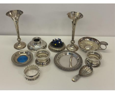 A nice collection of mixed silver etc, to include weighted pin cushion, candle holder, pair of bud vases, together with napki