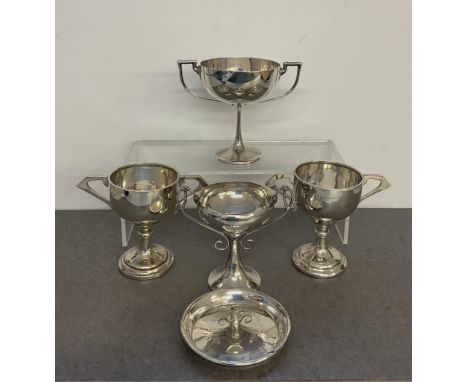 Four silver twin handled golfing trophy cups, engraved inscriptions from 1921-1949, London, Birmingham and Sheffield, up to 1