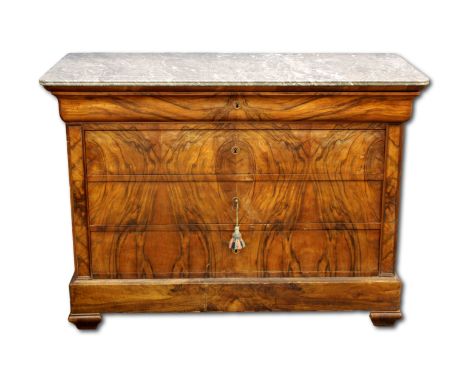 A 19th Century French burr walnut commode, Louis Philippe era, the grey marble top above a hidden drawer and three long drawe
