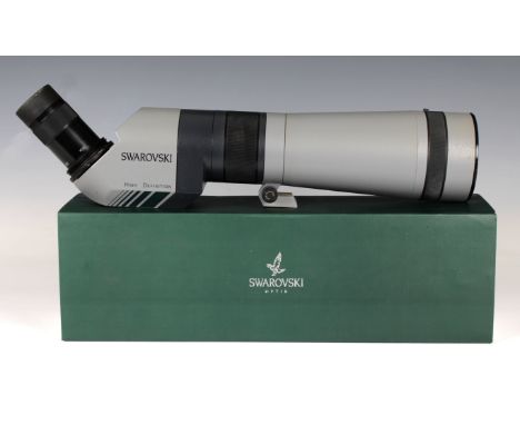 A boxed Swarovski AT 80 HD telescope with 20-60x Swarovski eyepiece, and a manfrotto tripod &amp; head.