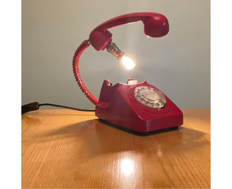 A vintage  Red Telephone upcycled to make a light, fully working, PAT tested.