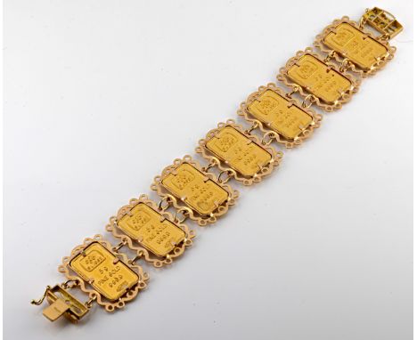 A gold ingot bracelet, comprising seven Swiss 5 gram ingots of gold 999.9, bearing emblem of Saudi Arabia, mounted in an 18ct
