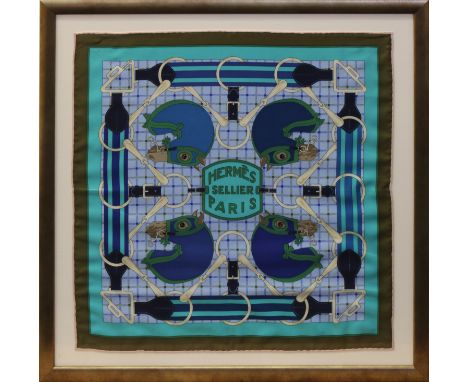 A framed and glazed HERMÈS SELLIER PARIS silk handkerchief, multi-coloured in blues &amp; greens depicting race horses, frame