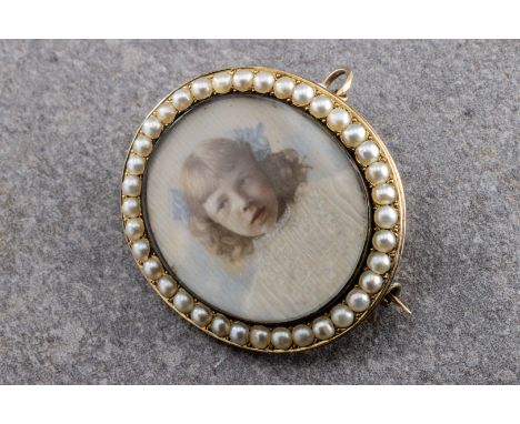 Gold and pearl portrait miniature brooch, of a girl wearing blue bows, wishing a seed pearl surround, pendant attachment, len