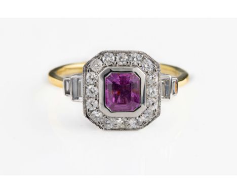 An 18ct yellow and white gold Art Deco style ring, set with an emerald-cut pink sapphire and baguette and round brilliant cut