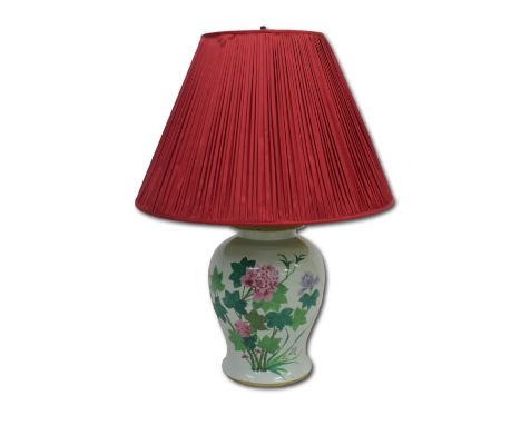 A Chinese baluster vase form lamp, decorated with famille rose enamels and extensively inscribed, together with a red shade,