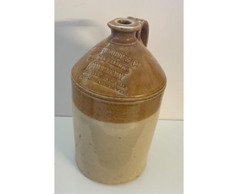 Stoneware two tone flagon, impressed 'BUCKTROUT &amp; Co (THOMAS ELLIOTT) GUERNSEY, LENT JAR NOT FOR SALE BOTTLE DEALERS BEWA
